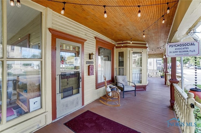 wooden terrace featuring a porch