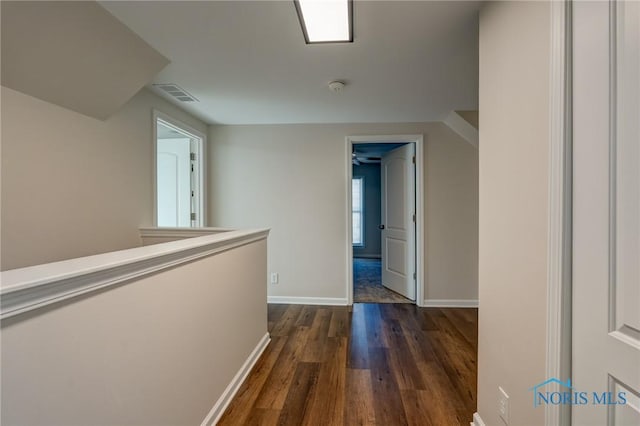 hall with dark hardwood / wood-style flooring