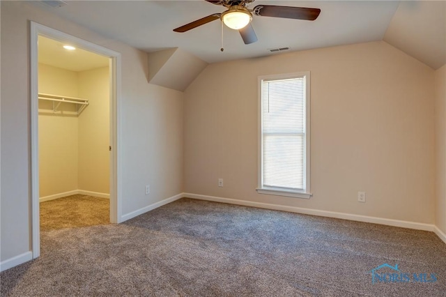 additional living space featuring lofted ceiling, carpet flooring, and ceiling fan