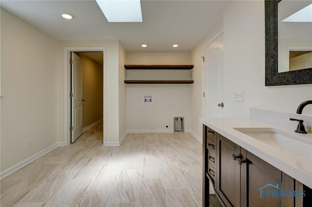 bathroom with sink and a skylight