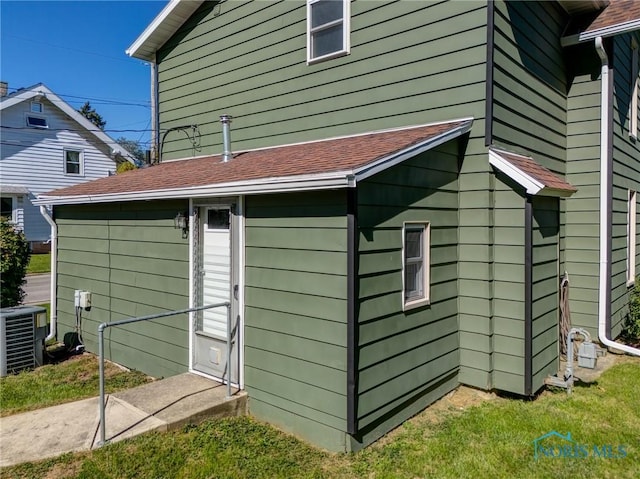 view of property exterior with central AC