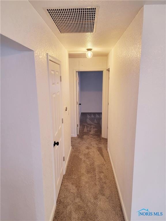 corridor with carpet flooring