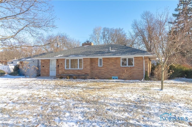 view of snow covered house