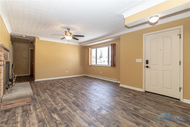 foyer with ceiling fan, a fireplace, dark hardwood / wood-style flooring, and a baseboard heating unit