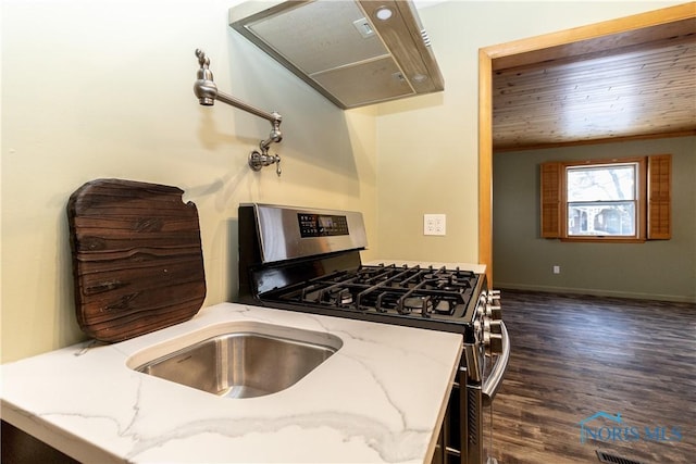 kitchen featuring light stone counters, extractor fan, wooden ceiling, and gas stove