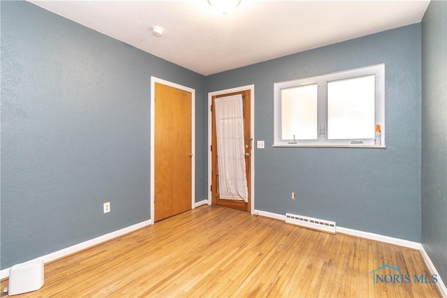 empty room featuring light hardwood / wood-style floors