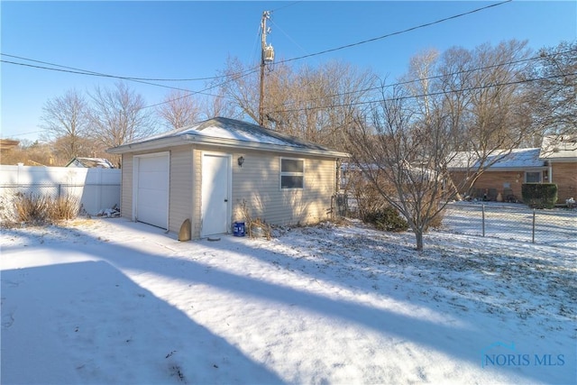 view of snow covered garage