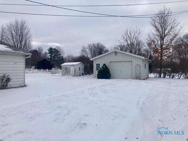 view of snow covered garage