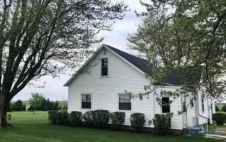 view of side of property featuring a yard