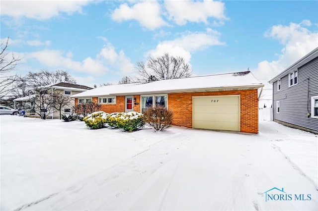 single story home featuring a garage