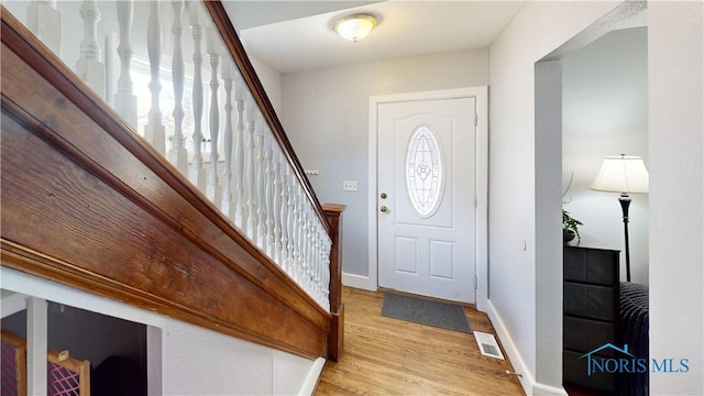 foyer with light hardwood / wood-style floors