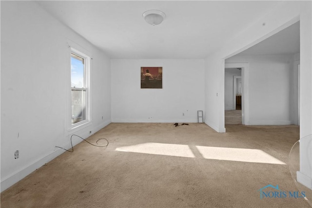 empty room featuring light colored carpet