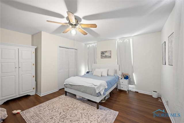 bedroom featuring dark wood-type flooring, ceiling fan, and a closet