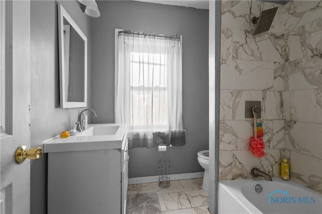 full bathroom featuring toilet, vanity, and tiled shower / bath