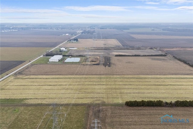 birds eye view of property with a rural view