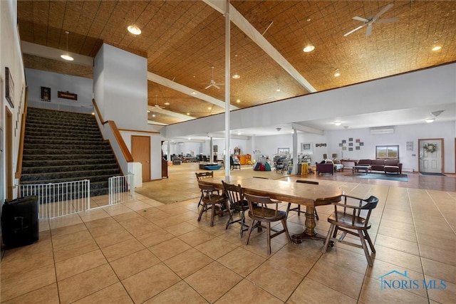 dining area featuring high vaulted ceiling, ceiling fan, and light tile patterned flooring