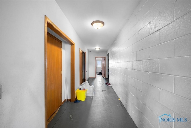 corridor featuring concrete floors