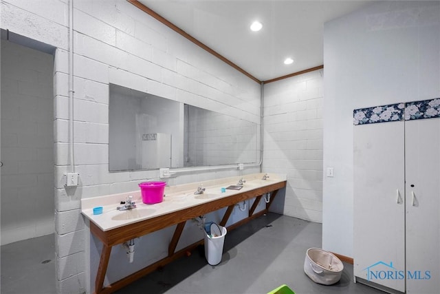 bathroom with concrete flooring and sink