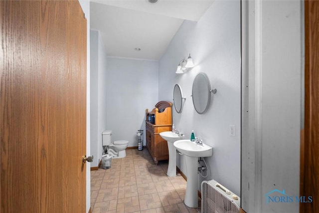 bathroom featuring a bidet and toilet