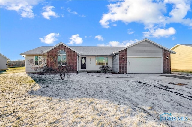 single story home featuring a garage