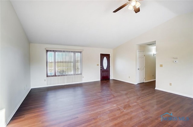 unfurnished living room with dark hardwood / wood-style flooring, ceiling fan, and vaulted ceiling