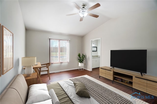 living room with ceiling fan, vaulted ceiling, and dark hardwood / wood-style floors