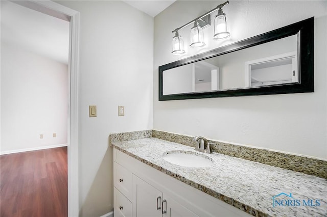 bathroom with wood-type flooring and vanity