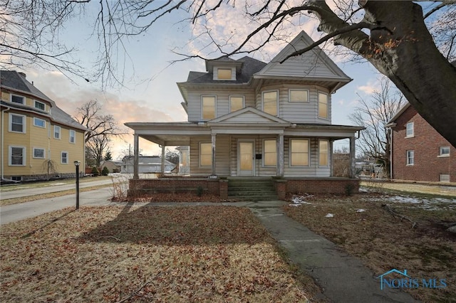 victorian house featuring covered porch