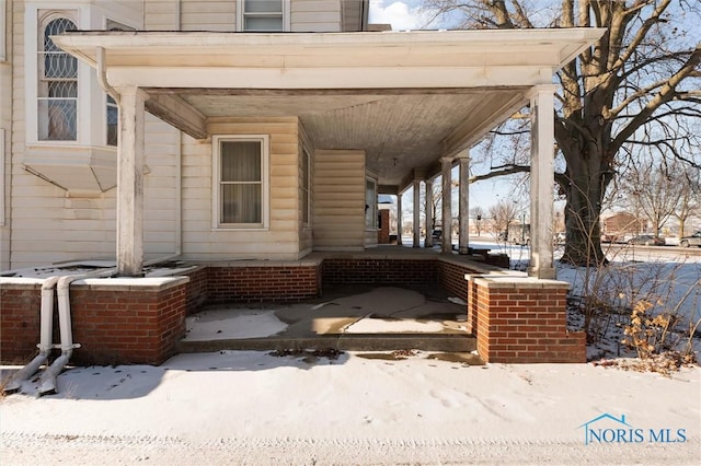 view of snow covered patio