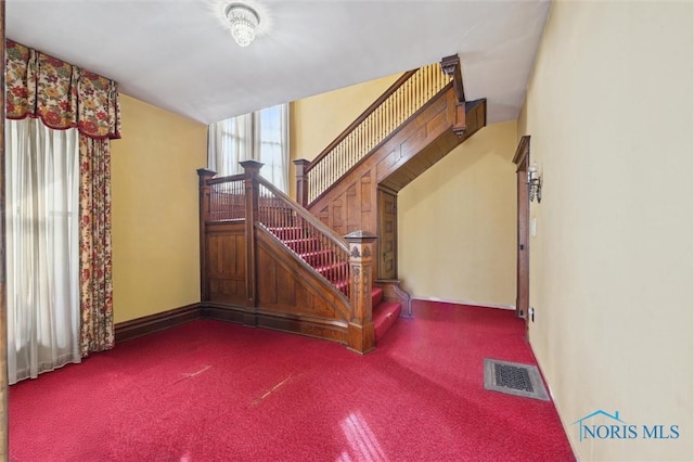 stairway with carpet floors