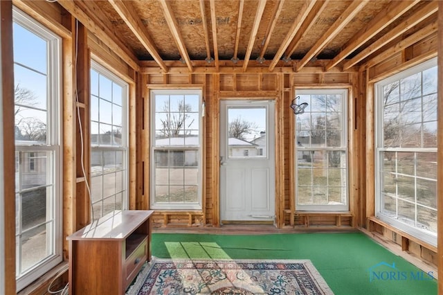 unfurnished sunroom featuring a wealth of natural light