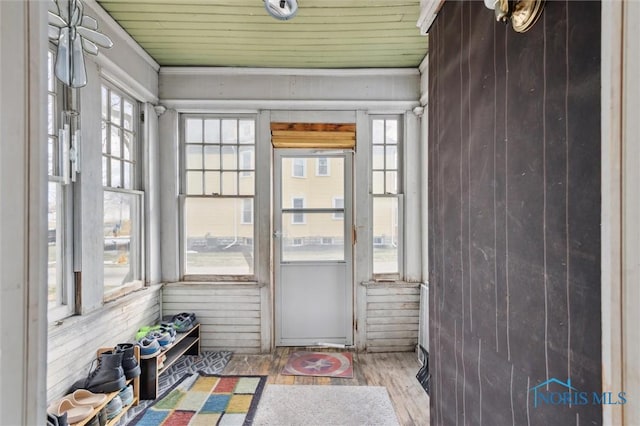 unfurnished sunroom featuring wooden ceiling and a healthy amount of sunlight