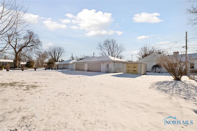 exterior space featuring a shed and a garage