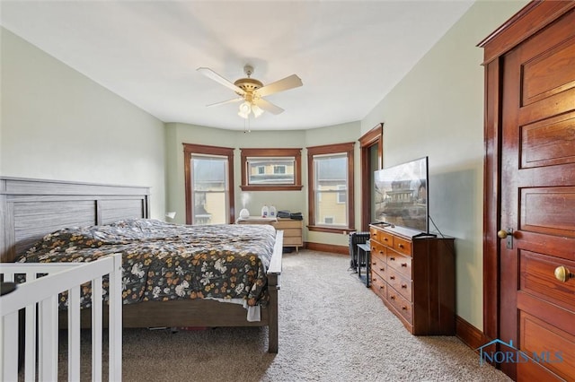 bedroom featuring light carpet and ceiling fan