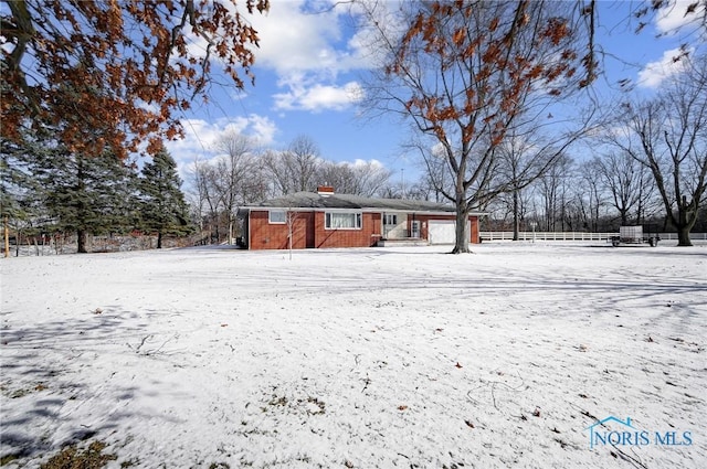 view of snow covered house