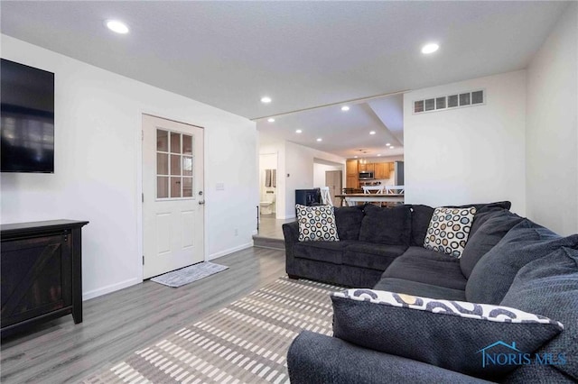 living room with hardwood / wood-style floors