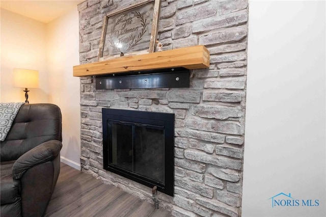 room details featuring hardwood / wood-style floors and a fireplace