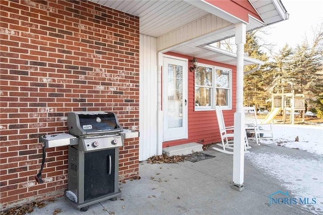 view of patio featuring grilling area and a playground