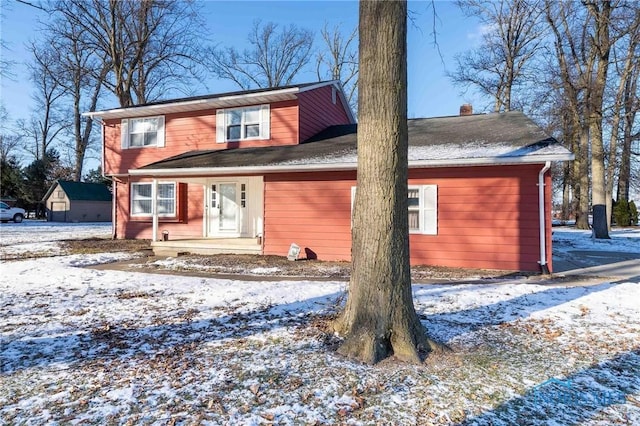 view of snow covered house