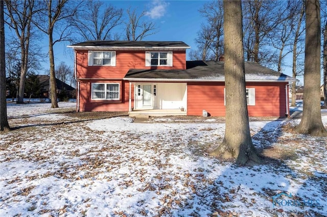 view of snow covered house