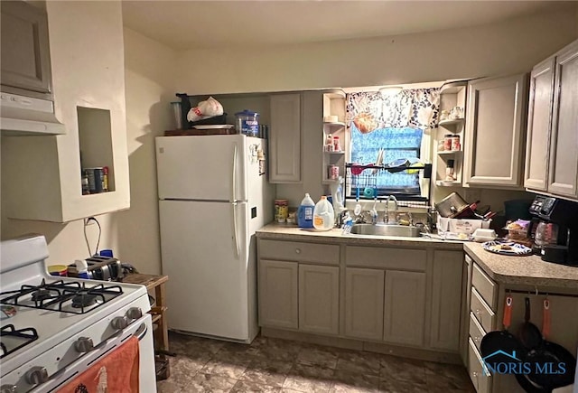 kitchen with white appliances, gray cabinets, and sink