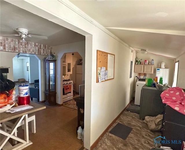 interior space featuring washer / clothes dryer and ceiling fan