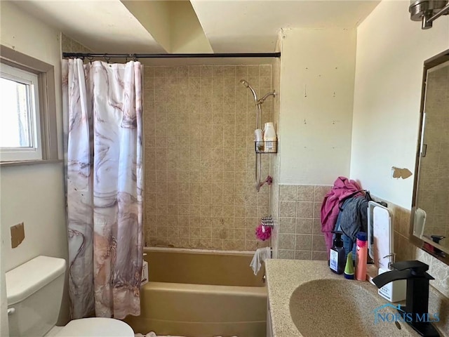 full bathroom featuring sink, shower / bath combo, and toilet