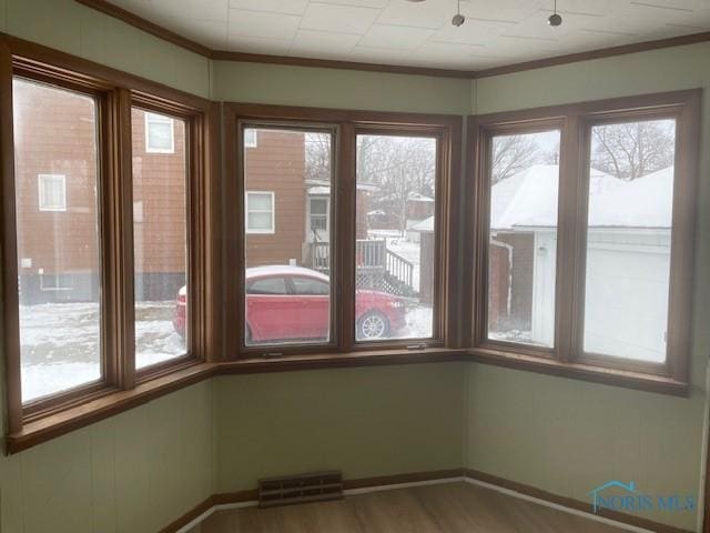 unfurnished sunroom with plenty of natural light