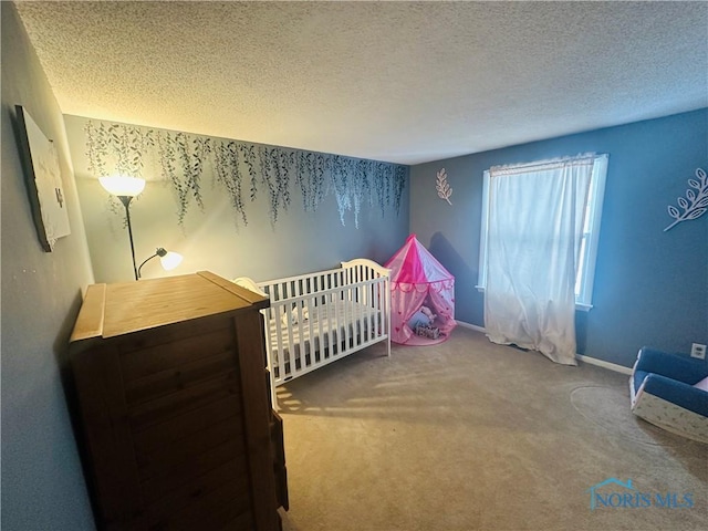 carpeted bedroom with a textured ceiling