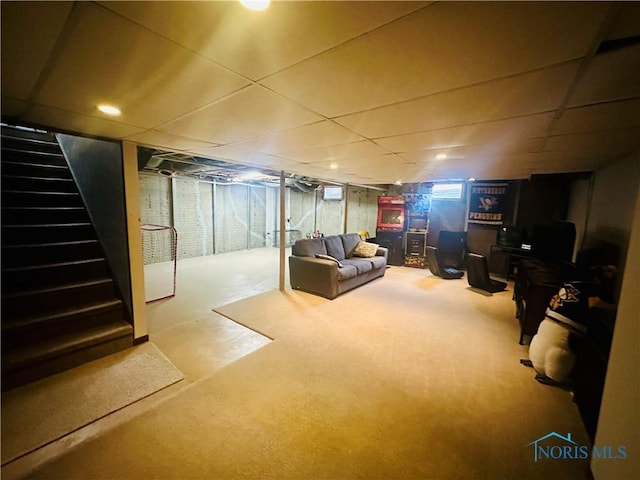 basement featuring a paneled ceiling