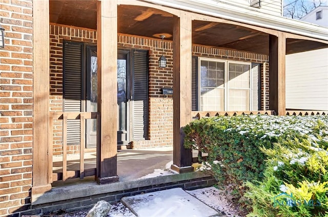 view of exterior entry featuring a porch