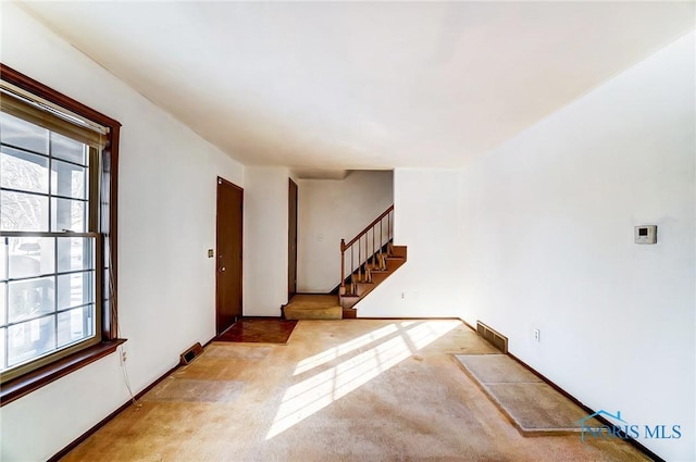 foyer with light carpet