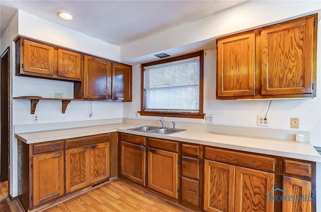 kitchen featuring sink and light hardwood / wood-style flooring