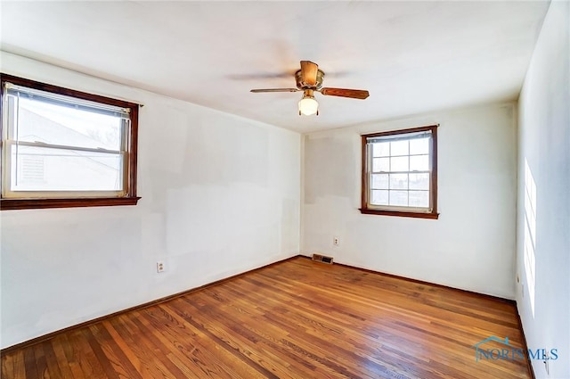 unfurnished room featuring ceiling fan and wood-type flooring